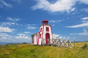 Canada, Quebec, Kamouraska. Lighthouse on shore of St. Lawrence River Canada, Quebec, Kamouraska. Lighthouse on shore of St. Lawrence River