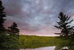 Images Dated 9th August 2015: Canada, Quebec, Lake Long Pond. Sunset on lake and forest