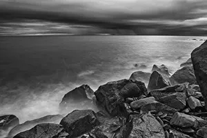 Canada, Quebec, Ruisseau Castor. Shoreline rocks on Gulf of St. Lawrence in storm light Canada, Quebec, Ruisseau Castor. Shoreline rocks on Gulf of St. Lawrence in storm light