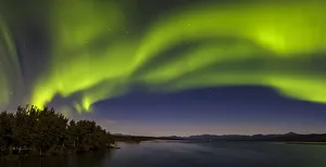Canada, Yukon. Northern lights reflected in Marsh Lake at Tagish Canada, Yukon. Northern lights reflected in Marsh Lake at Tagish