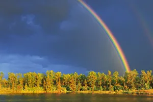 Canada, Yukon, Saskatchewan. Rainbow over forest and lake. Canada Canada, Yukon, Saskatchewan. Rainbow over forest and lake. Canada