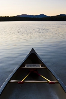 A canoe on the shore of White Lake at White Lake State Park in Tamworth, New Hampshire A canoe on the shore of White Lake at White Lake State Park in Tamworth, New Hampshire