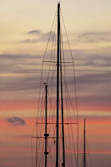 Caribbean, Grenada, Saint Vincent. Sailboat mast at sunset