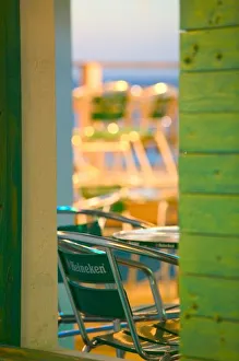 <b class=qtipBold><figcaption>Caribbean, TURKS</figcaption></b><br>Caribbean, TURKS & CAICOS, Grand Turk Island, Cockburn Town: Water's Edge Cafe, Cafe Chairs<br><em>© Walter Bibikow / DanitaDelimont.com</em> Caribbean, TURKS