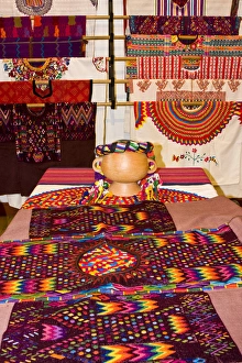 Central America, Guatemala, Antigua. A display of colorful huipils in a shop in Antigua Central America, Guatemala, Antigua. A display of colorful huipils in a shop in Antigua