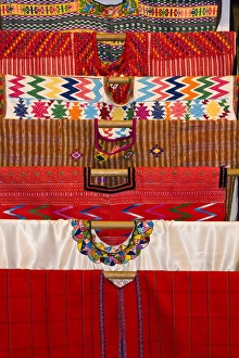 Central America, Guatemala, Antigua. A display of colorful huipils in a shop in Antigua Central America, Guatemala, Antigua. A display of colorful huipils in a shop in Antigua