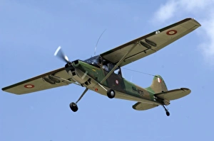 Cessna OE-1 Bird Dog at CAF Air Show showing Maltese markings in the sky Cessna OE-1 Bird Dog at CAF Air Show showing Maltese markings in the sky
