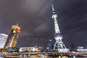 China, Shanghai, Oriental Pearl Radio & TV Tower rises 1, 535aAA above traffic circle China, Shanghai, Oriental Pearl Radio & TV Tower rises 1, 535aAA above traffic circle