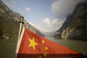 Chinese flag astern as passes through a Yangzi gorge.Chinese flag and Qutang Gorge Chinese flag astern as passes through a Yangzi gorge.Chinese flag and Qutang Gorge