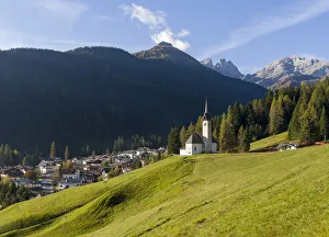 The church, in the background Focobon mountain range in the Pale di San Martino The church, in the background Focobon mountain range in the Pale di San Martino