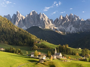 The church Sankt Magdalena in the Villnoess valley in the Dolomites during autumn The church Sankt Magdalena in the Villnoess valley in the Dolomites during autumn