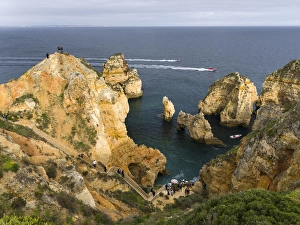 The cliffs and sea stacks of Ponta da Piedade at the rocky coast of the Algarve in Portugal The cliffs and sea stacks of Ponta da Piedade at the rocky coast of the Algarve in Portugal