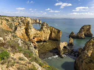 The cliffs and sea stacks of Ponta da Piedade at the rocky coast of the Algarve in The cliffs and sea stacks of Ponta da Piedade at the rocky coast of the Algarve in