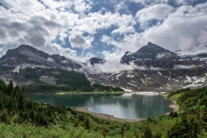 Clouds over an alpine lake in Assiniboine Provincial Park Clouds over an alpine lake in Assiniboine Provincial Park