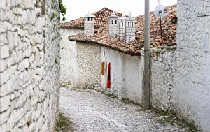 Cobble stone street with traditional ottoman white stone houses Cobble stone street with traditional ottoman white stone houses