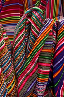 Colorful blankets on display at market, Huaraz, Peru Colorful blankets on display at market, Huaraz, Peru