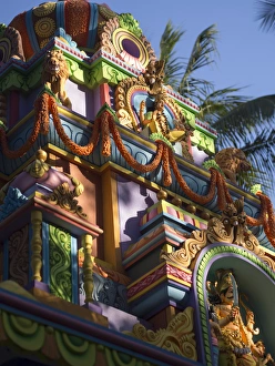 A colorful Hindu temple is decorated with colors and flower wreaths in Bangalore A colorful Hindu temple is decorated with colors and flower wreaths in Bangalore