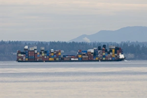 Colorful load on barge in Admiralty Inlet between Whidbey Island and Olympic Peninsula Colorful load on barge in Admiralty Inlet between Whidbey Island and Olympic Peninsula