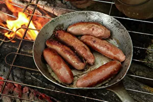 Camping Gallery: Cooking sausages on a campfire, Central Otago, South Island, New Zealand
