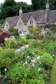 Cotswold stone cottage and garden in Bibury, Gloucestershire, England Cotswold stone cottage and garden in Bibury, Gloucestershire, England
