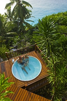 Couple enjoying hot tub at Fregate Resort (MR) (PR) Couple enjoying hot tub at Fregate Resort (MR) (PR)