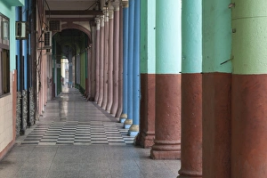 Cuba, Havana. Repeating columns of an arcade along the Paseo del Prado Cuba, Havana. Repeating columns of an arcade along the Paseo del Prado