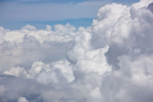 Cumulus clouds as seen from high above the tropical coastline of Costa Rica Cumulus clouds as seen from high above the tropical coastline of Costa Rica