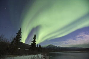 Images Dated 12th October 2006: Curtains of green aurora borealis dance in the sky over the Middle Fork of the Koyukuk