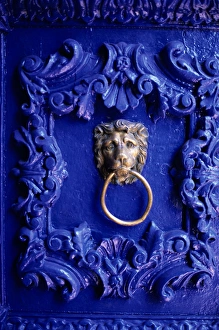 Cusco, Peru. Ornate blue painted door with lion knocker; Hotel Garcilaso Cusco, Peru. Ornate blue painted door with lion knocker; Hotel Garcilaso