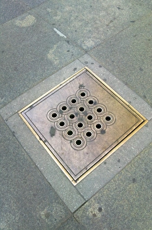 Decorated sewer cover in Prague Castle, Czech Republic Decorated sewer cover in Prague Castle, Czech Republic