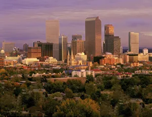 Denver, Colorado skyline glistens in early morning during sunrise against the Rocky Denver, Colorado skyline glistens in early morning during sunrise against the Rocky