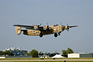 Diamond Lil B-24 Bomber, landing at Oshkosh, Wisconsi Diamond Lil B-24 Bomber, landing at Oshkosh, Wisconsi