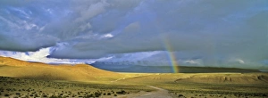 Dirt Road with rainbow, Altiplano, Chile, near Salar de Surire...America, South America Dirt Road with rainbow, Altiplano, Chile, near Salar de Surire...America, South America