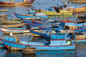 Distinctive red and blue fishing fleet in major fishing port of Nha Trang