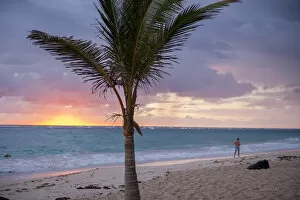 Images Dated 12th March 2011: Dominican Republic, Punta Cana, Higuey, Bavaro, Bavaro Beach, man jogging, sunrise