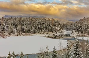 Early season snowfall on the Flathead River in the Flathead National Forest, Montana, USA Early season snowfall on the Flathead River in the Flathead National Forest, Montana, USA