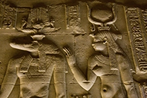 Egypt, Kom Ombo. Egyptian gods Sobek, the crocodile and Isis, mother of life on a Egypt, Kom Ombo. Egyptian gods Sobek, the crocodile and Isis, mother of life on a