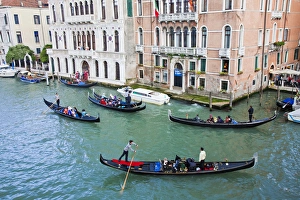 Euorpe; Italy; Venice; Gondolas with with riders dressed in carnival Attire Euorpe; Italy; Venice; Gondolas with with riders dressed in carnival Attire