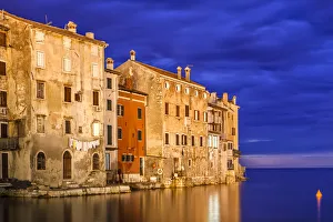 Europe, Croatia, Rovinj. Sunset on ocean and town Europe, Croatia, Rovinj. Sunset on ocean and town