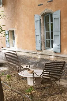 <b class=qtipBold><figcaption>Europe, France</figcaption></b><br>Prieure de St Jean de Bebian. Pezenas region. Languedoc. The villa. Window. Lounging chairs, garden furniture. In the garden. France. Europe.<br><em>© Copyright Per Karlsson / Danita Delimont</em> Europe, France