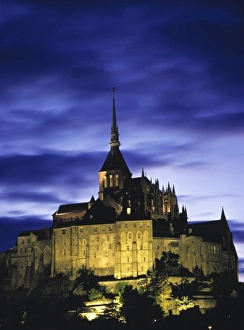 Europe, France, Le Mont St.-Michel. Flood lights add relief to the interesting Europe, France, Le Mont St.-Michel. Flood lights add relief to the interesting