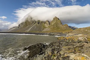 Europe, Iceland. Clouds drape the mountains of Eystrahorn on the south coast Europe, Iceland. Clouds drape the mountains of Eystrahorn on the south coast