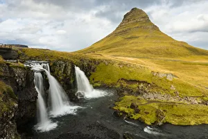 Europe, Iceland. Iconic view of Kirkjufell mountain with waterfall in foreground Europe, Iceland. Iconic view of Kirkjufell mountain with waterfall in foreground