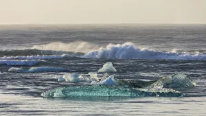 Europe, Iceland. Morning light shines on ice chunks on Diamond Beach near Jokulsarlon Europe, Iceland. Morning light shines on ice chunks on Diamond Beach near Jokulsarlon
