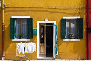 Europe; Italy; Burano; Bright Colored Home with Laundry Out Europe; Italy; Burano; Bright Colored Home with Laundry Out