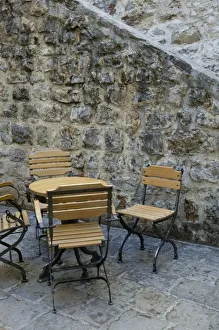 <b class=qtipBold><figcaption>Europe, Montenegro</figcaption></b><br>Montenegro-Budva:Budva Old Town / Stari Grad- Cafe Table and Chairs<br><em>© Walter Bibikow / DanitaDelimont.com</em> Europe, Montenegro