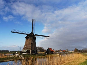 Images Dated 19th April 2013: Europe; Netherlands; Nord Holland; Windmill along canal of Nord Holland