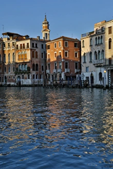 Evening light on Grand Canal and its reflection of old buildings and belltower, Venice Evening light on Grand Canal and its reflection of old buildings and belltower, Venice