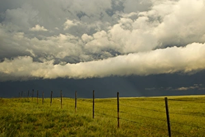 Fenceline during severe thunderstorm near Browning, Montana, USA Fenceline during severe thunderstorm near Browning, Montana, USA
