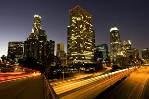Images Dated 2nd December 2007: First light from sunrise illuminates downtown Los Angeles wih traffic streaking across